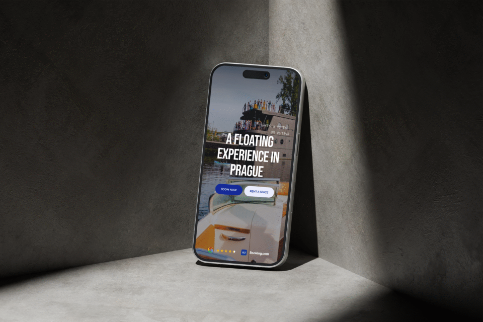 Mobile phone with a website about a floating restaurant experience in Prague