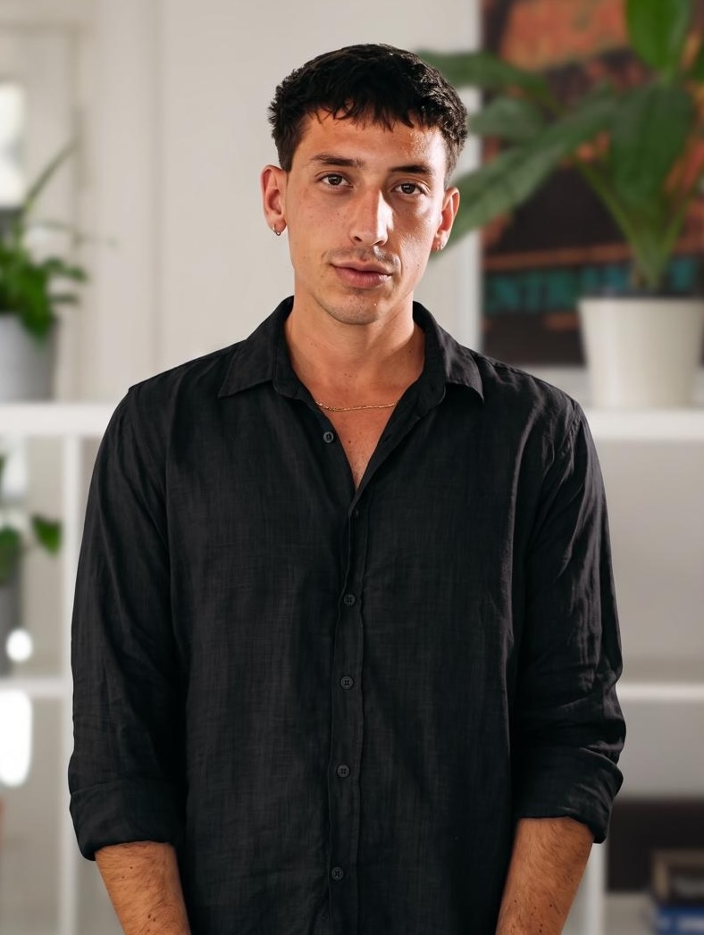 A portrait of Ondřej Kocziszki, a member of the Apadore team, wearing a black shirt