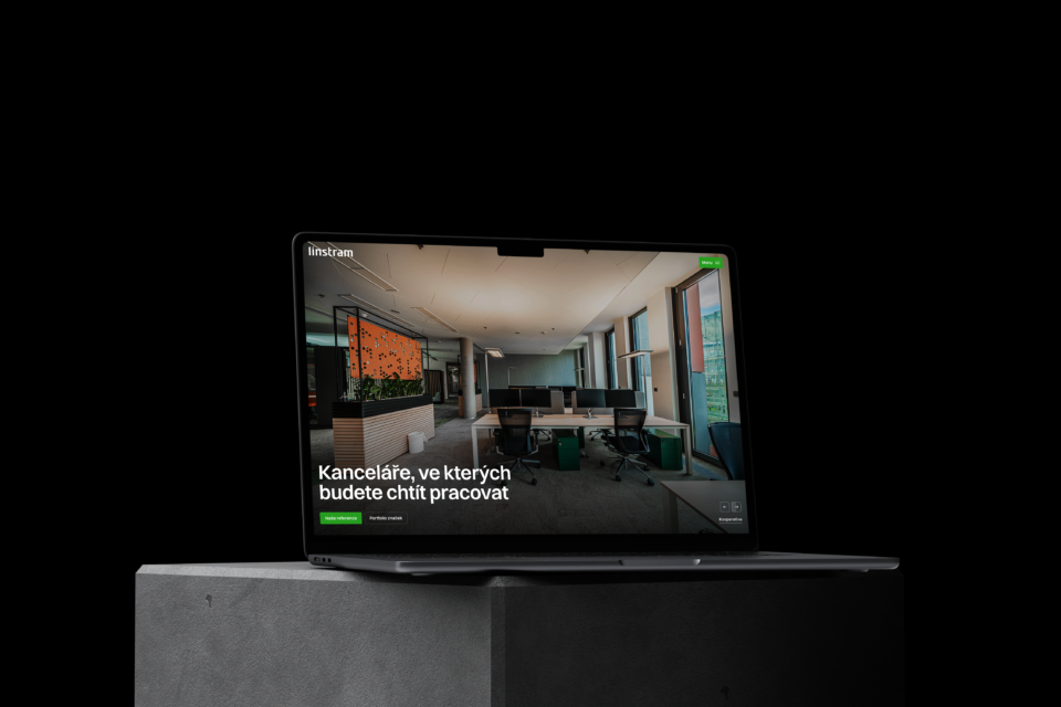 A laptop on a dark background with the Linstram website and a headline about offices where you'll want to work